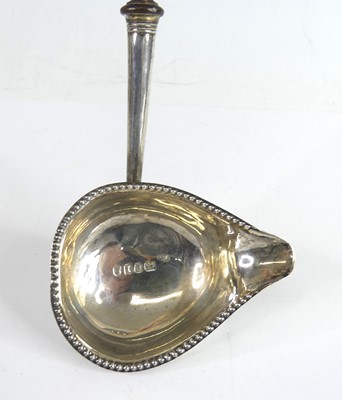 Lot 2070 - A George III silver toddy ladle, having...
