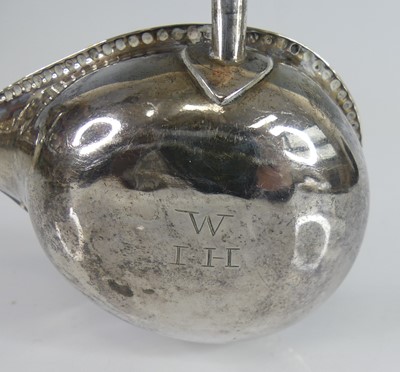 Lot 2070 - A George III silver toddy ladle, having...