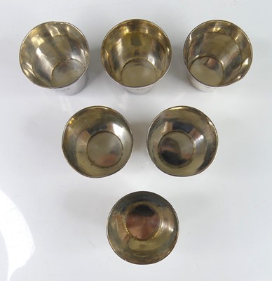 Lot 100 - A set of six circa 1900 silver spirit measures,...