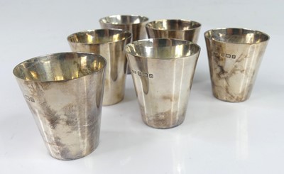 Lot 100 - A set of six circa 1900 silver spirit measures,...