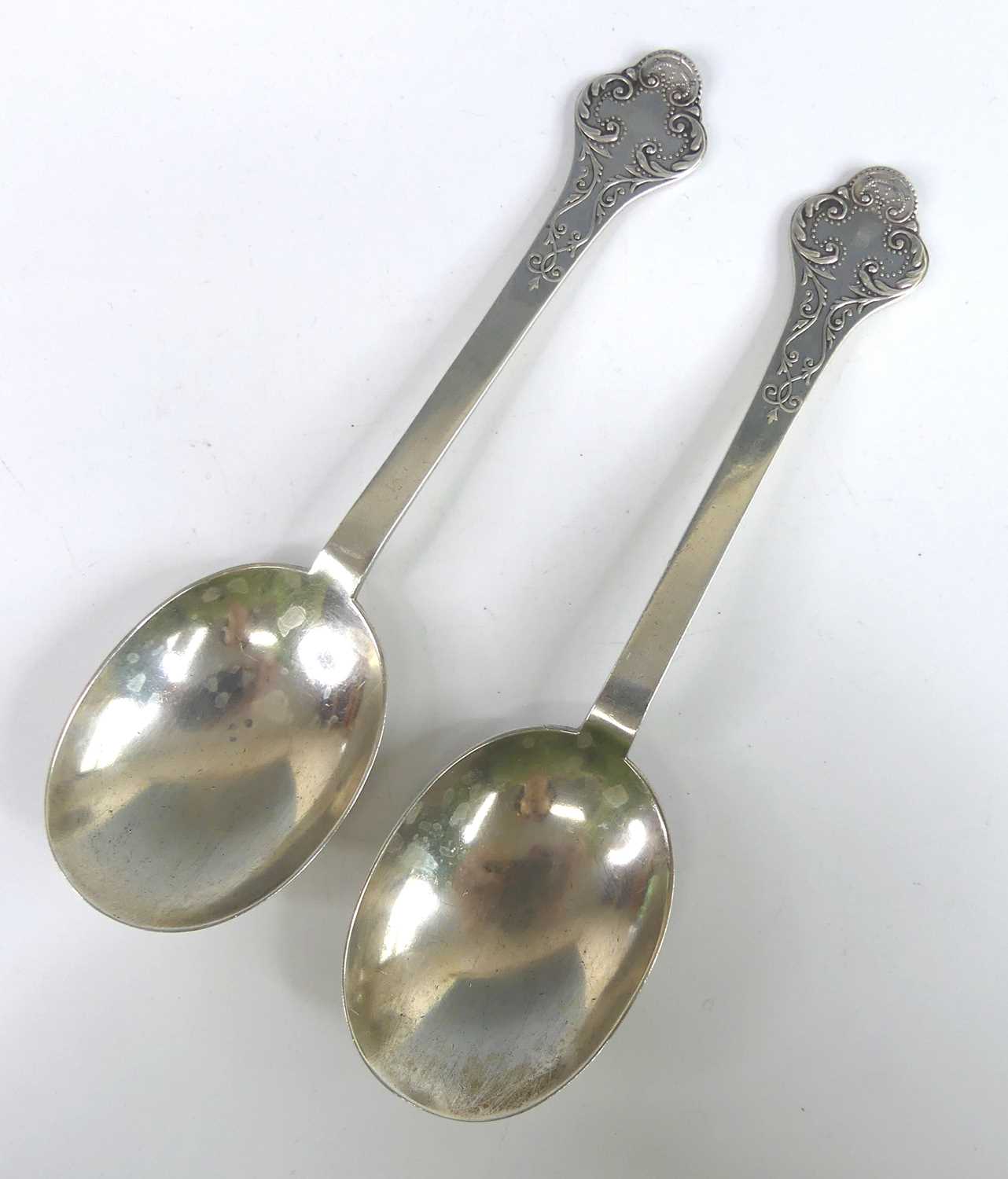 Lot 2064 - A pair of Edwardian silver fancy-back dognose...