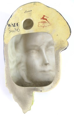 Lot 22 - A 1930s Wade cellulose wall mask, modelled as...
