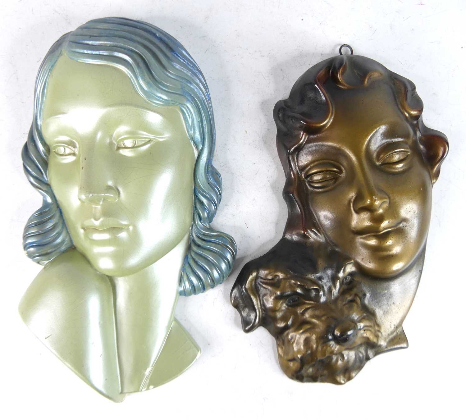 Lot 23 - Two 1930s painted plaster wall masks, each...