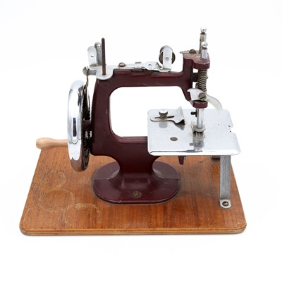 Lot 106 - Essex MK-1 miniature sewing machine, in maroon,...