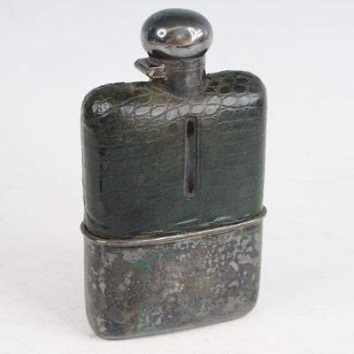 Lot 407 - A late Victorian hip flask, the glass body...