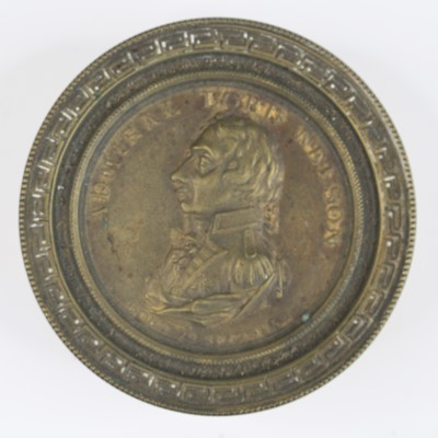 Lot 138 - A Nelson souvenir brass snuff box, of circular...