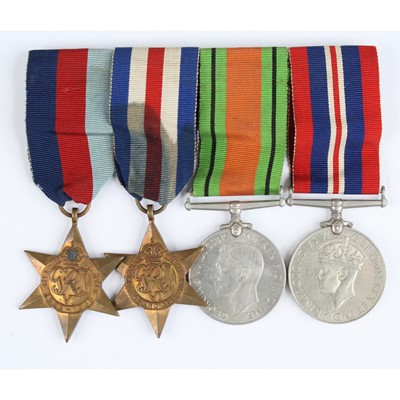 Lot 12 - A group of four WW II medals to include...
