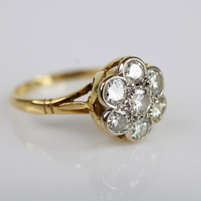 Lot 2036 - An 18ct yellow and white gold, diamond daisy...