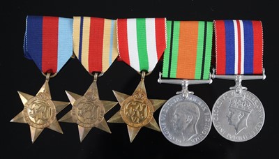 Lot 99 - A group of five WW II medals to include...