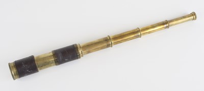 Lot 36 - An early 20th century brass and leather clad...