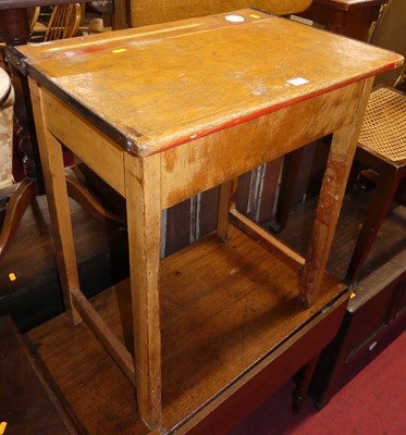 Lot 676 - A mahogany kneehole writing Davenport with...