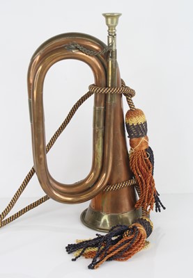 Lot 66 - A copper and brass mounted bugle, 29.5cm.