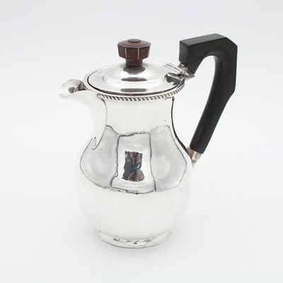 Lot 54 - A George V silver chocolate pot, of shaped...