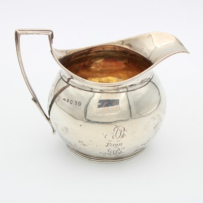 Lot 53 - A George III silver cream jug, of bulbous form...