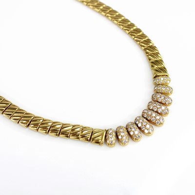 Lot 2099 - A yellow metal diamond articulated necklace,...