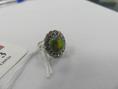 Lot 2073 - A white metal opal and diamond oval cluster...
