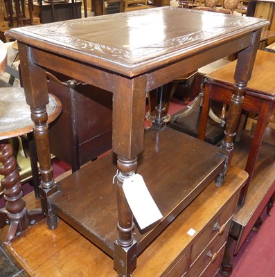Lot 678 - An early 20th century oak two-tier occasional...