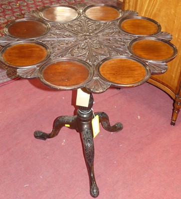 Lot 697 - A late 19th-century mahogany lobed dish topped...
