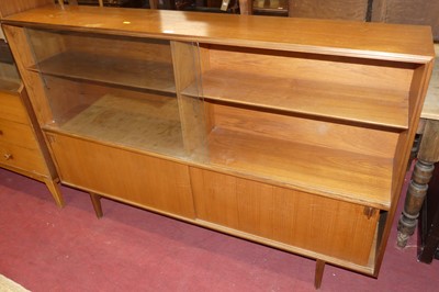 Lot 701 - A 1970s teak freestanding bookcase, having...