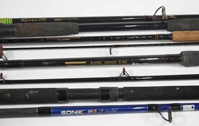 Lot 734 - A collection of fishing rods to include a...