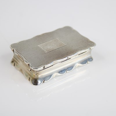 Lot 103 - An Elizabeth II silver snuff box, of shaped...