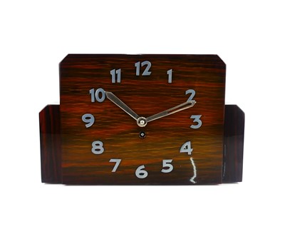 Lot 334 - An Art Deco calamander mantel clock, with...