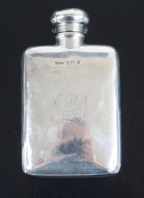 Lot 327 - An Edwardian silver hip flask, the body...