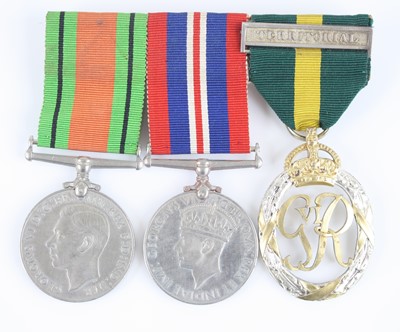 Lot 51 - A group of three medals to include WW II...