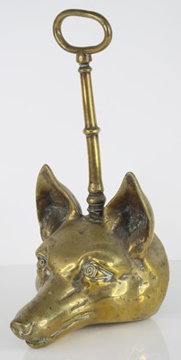 Lot 311 - A 19th century brass door porter, modelled as...