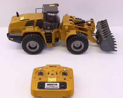 Lot 12 - Huina 1/14th scale radio-controlled wheeled...