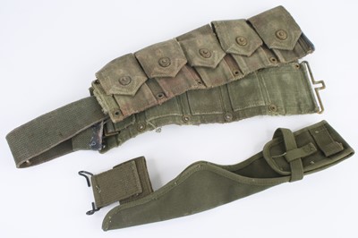 Lot 75 - A U.S. Army green canvas ten pocket ammunition...
