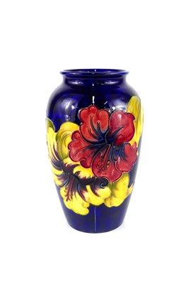 Lot 160 - A Moorcroft Hibiscus pattern pottery vase, of...