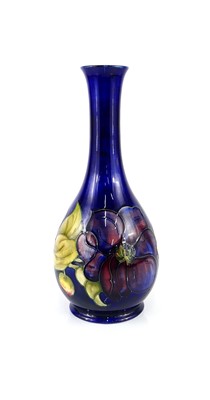 Lot 185 - A large Moorcroft Anemone pattern bottle...