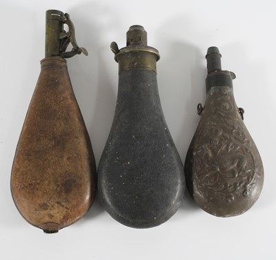 Lot 384 - A 19th century leather shot flask of typical...