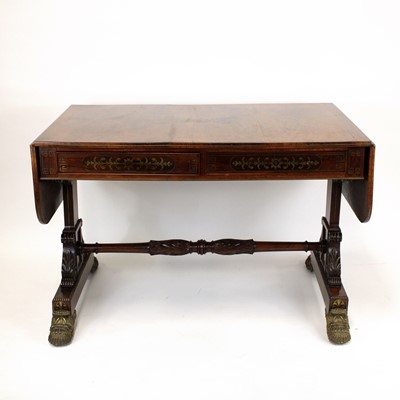 Lot 352 - A Regency rosewood and brass inlaid sofa table,...