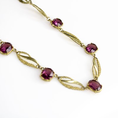 Lot 330 - A gilt metal and amethyst set necklace, 45cm