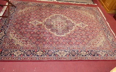 Lot 741 - A Persian woollen red ground Bokhara hall...