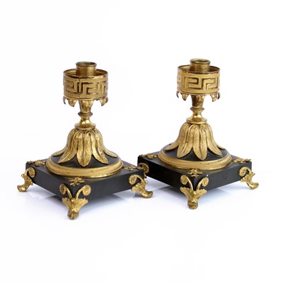 Lot 173 - A pair of bronze and gilt-bronze dwarf...