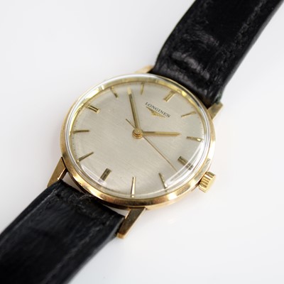 Lot 148 - A yellow metal Longines manual wind wristwatch,...