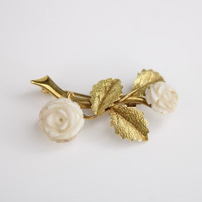 Lot 125 - A yellow metal bar brooch designed as a stem...