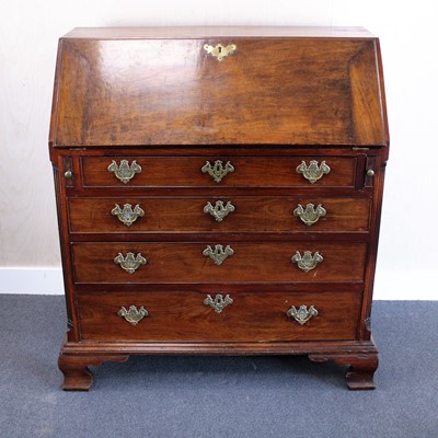 Lot 335 - A George III mahogany slopefront writing...