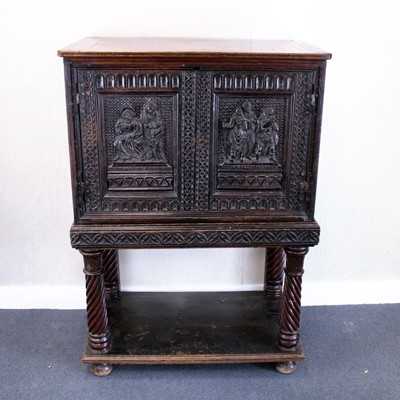 Lot 373 - An antique carved and joined oak cupboard on...