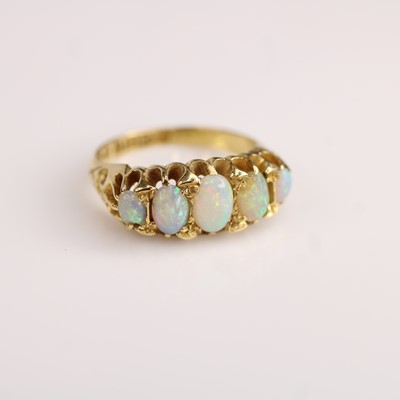 Lot 117 - An 18ct yellow gold opal half hoop ring...