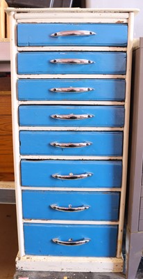 Lot 111 - A wooden 8-drawer bank of drawers containing a...