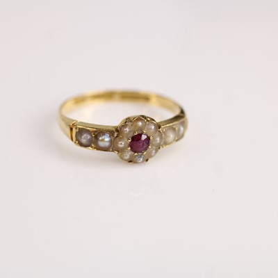 Lot 112 - A yellow metal ruby and pearl circular cluster...
