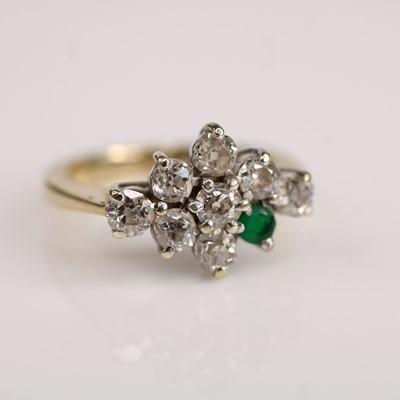 Lot 113 - A yellow and white metal diamond and emerald...