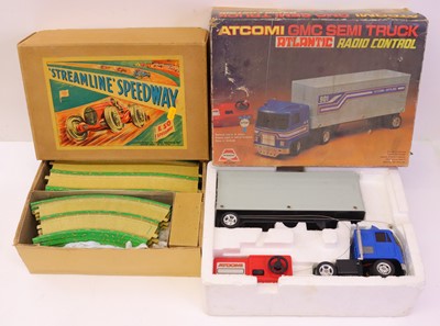 Lot 396 - A box containing two sets to include tinplate...