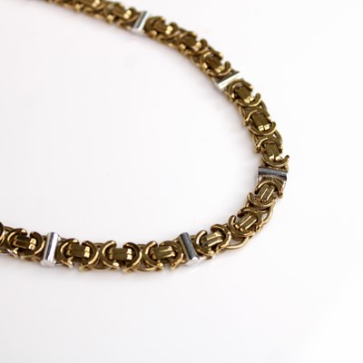 Lot 134 - A 9ct yellow and white gold fancy Byzantine...