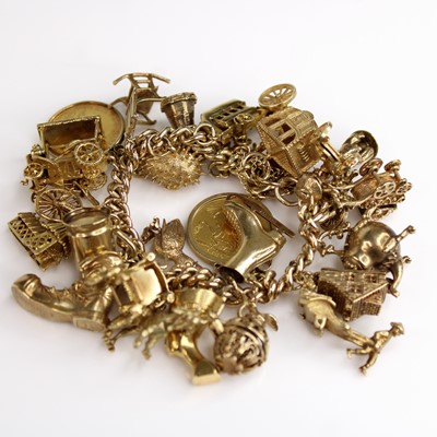 Lot 139 - A 9ct yellow gold curb link charm bracelet,...
