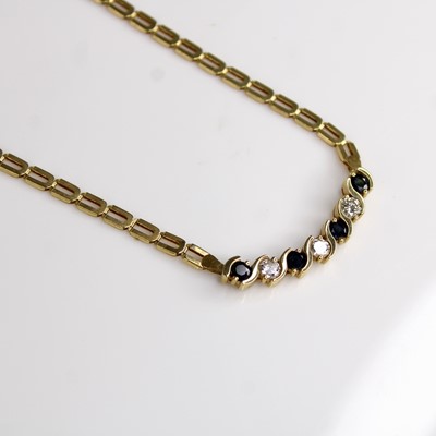 Lot 135 - A yellow metal, sapphire and diamond necklace,...